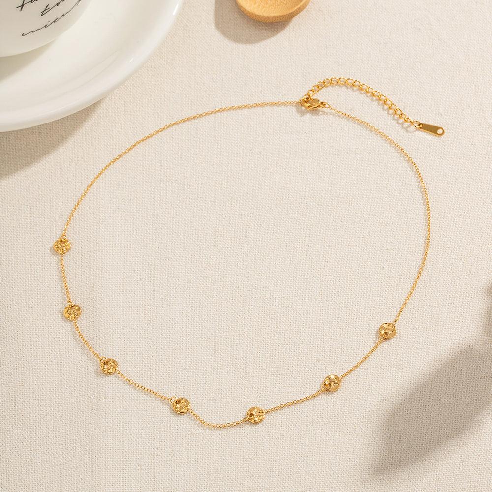 डिस्क टैसल नेकलेस