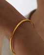 Buy gold-plated molten bangle bracelet. 