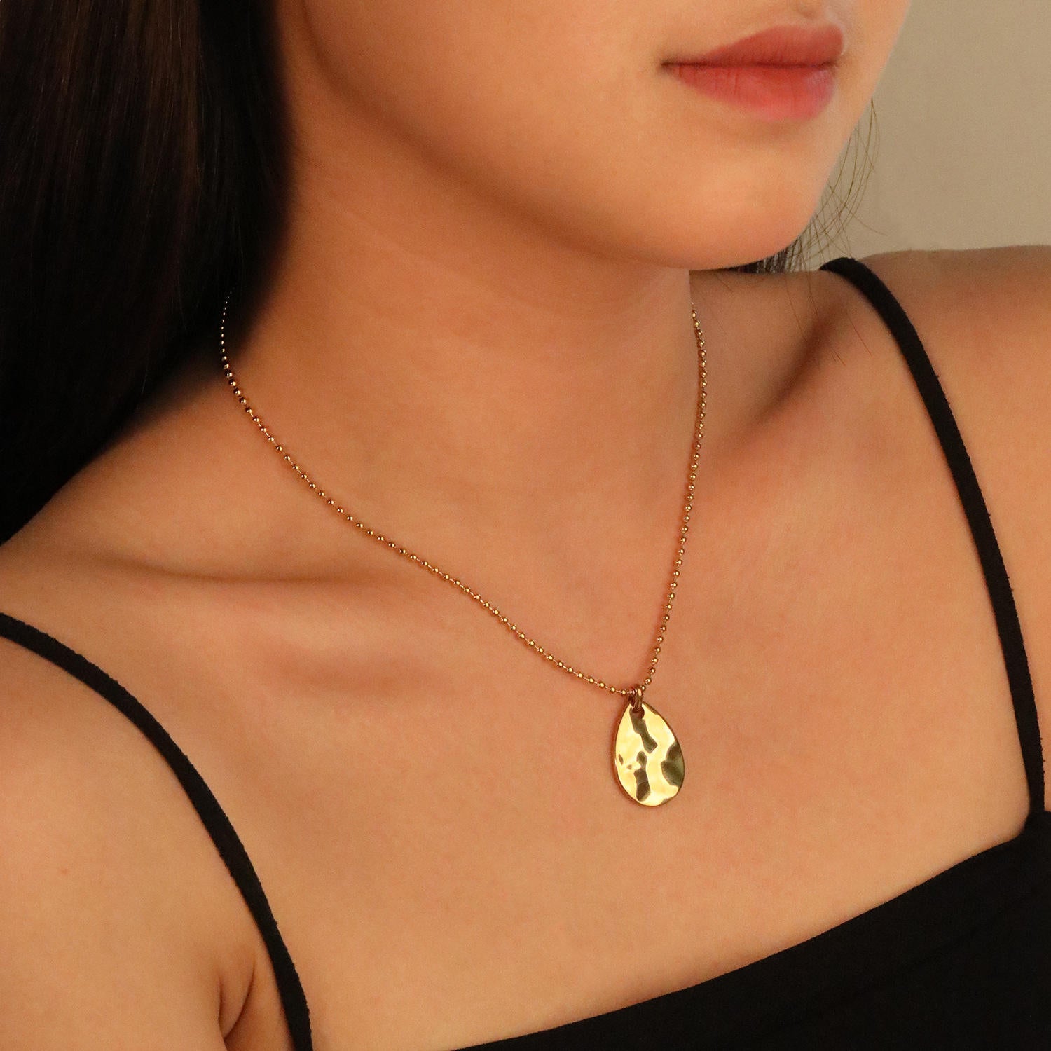 Buy gold-toned necklace with a hammered